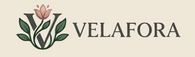 The brand logo for Velafora, featuring a stylized dark gray 'V' monogram with green leaves and a peach flower, alongside the brand name 'VELAFORA' in dark gray serif text on a solid dusty pink background.