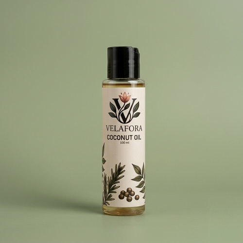 A 100 ml bottle of Velafora Coconut Oil with a black cap and a cream-colored label decorated with botanical illustrations, set against a solid sage green background.

