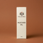 A tall, narrow white box of Velafora Mustard Oil, 100ml, standing upright against a solid warm brown background.